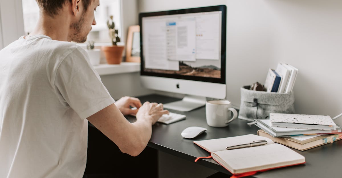 Photo Of Man Using Computer